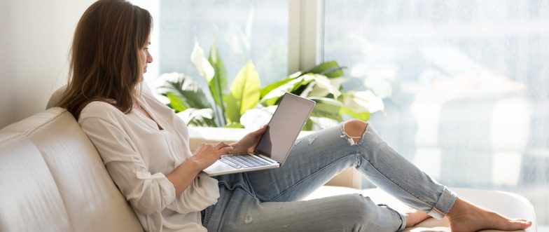 Lady sending money laptop content