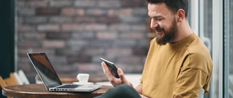Man looking at volt savings account on phone content