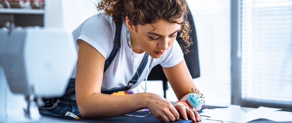 Woman pinning fabric content