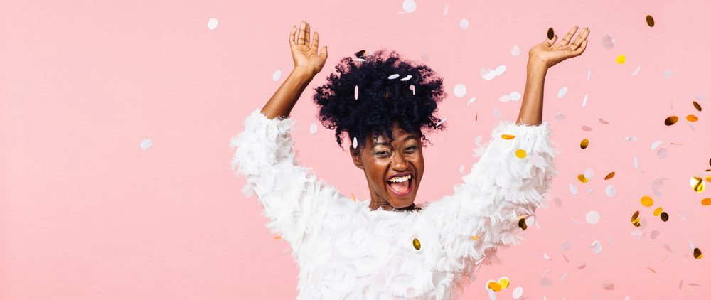 Woman celebrating taking control of debt content