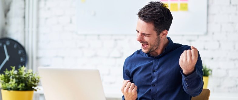 Man celebrating as home loan rates drop to new lows content