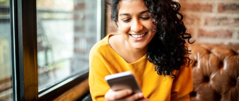 Woman using smartphone to bank content