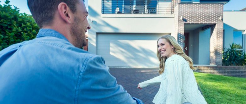 Couple running into house content