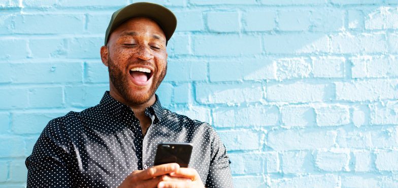 Man looking at low fixed mortgage rates on phone content
