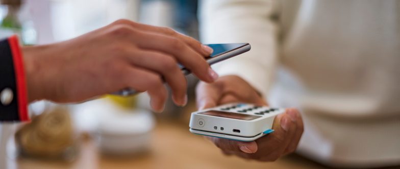 Person using smartphone to pay content