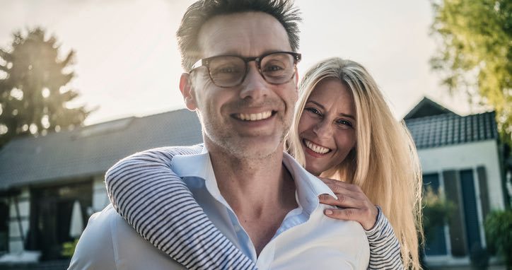 White shirt couple outside house article image content