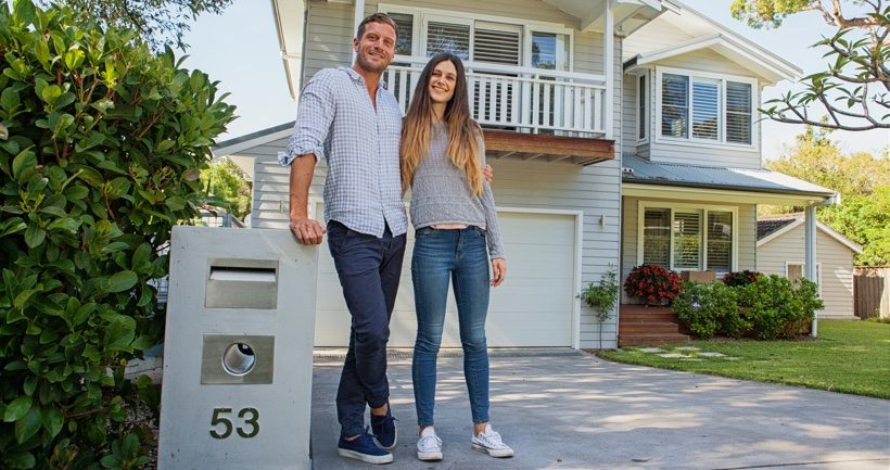 Couple standing by mailbox article image content