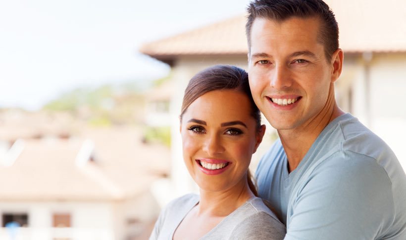 Brunette couple outside house closeup article image content