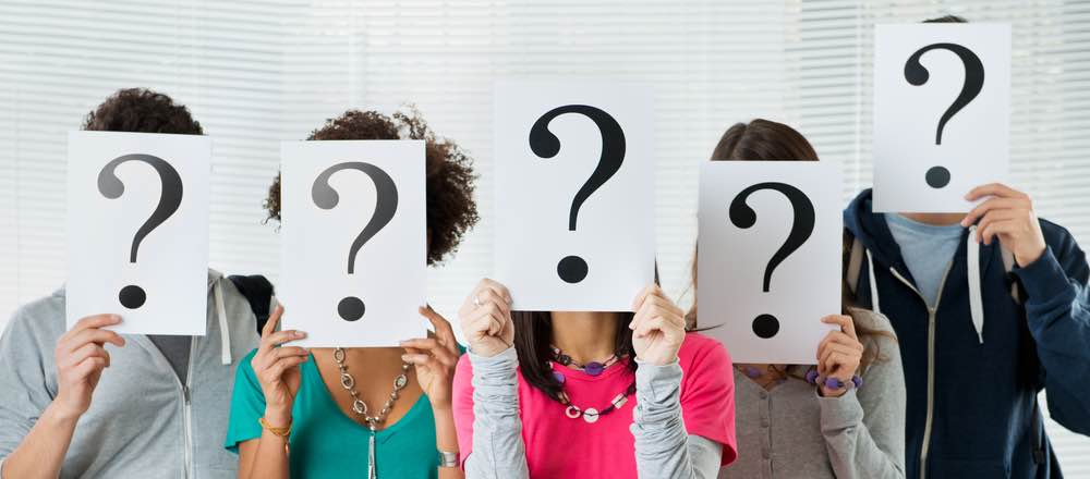 1 people abstract people holding question marks in front of their faces content