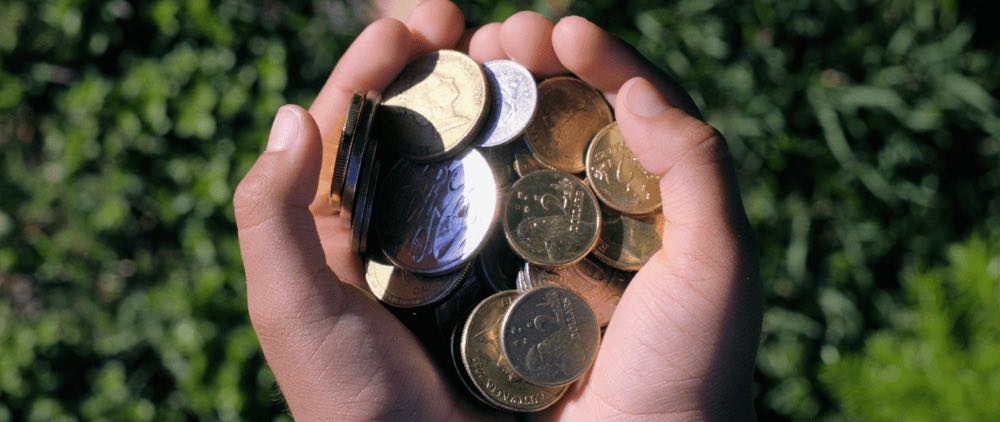 Kids holding australian money content