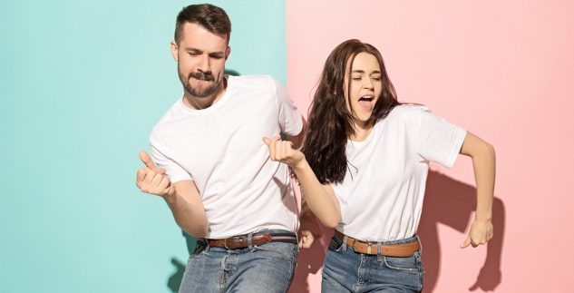 Happy man and woman dancing crop content