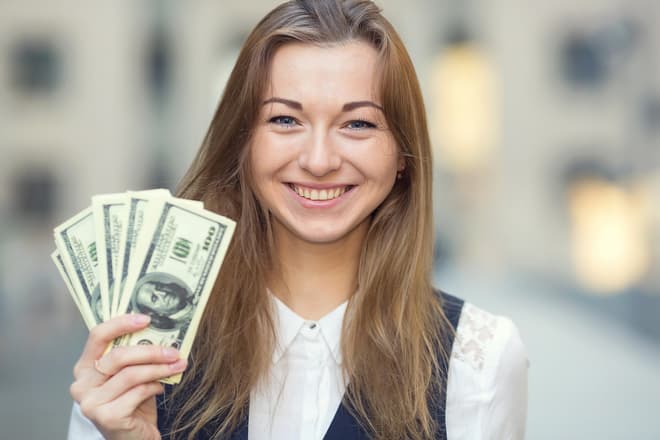 Sending money to the usa girl holding cash content