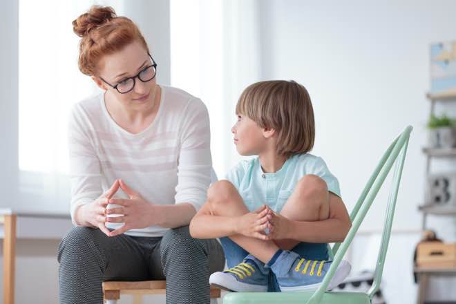 Mother giving son savings tips.