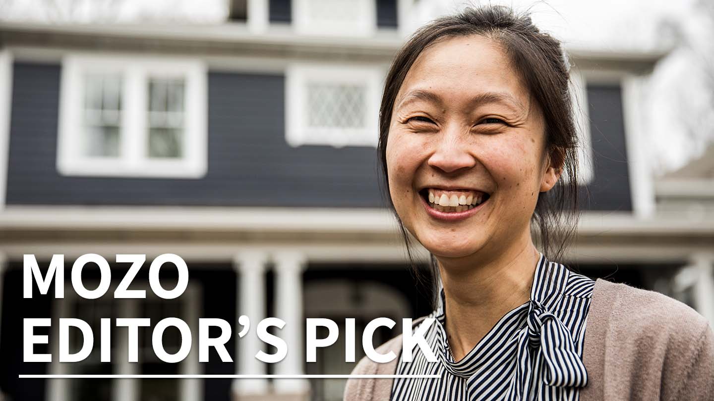 Woman in front of house smiling with 'Mozo Editor's Pick' written over the top of image.