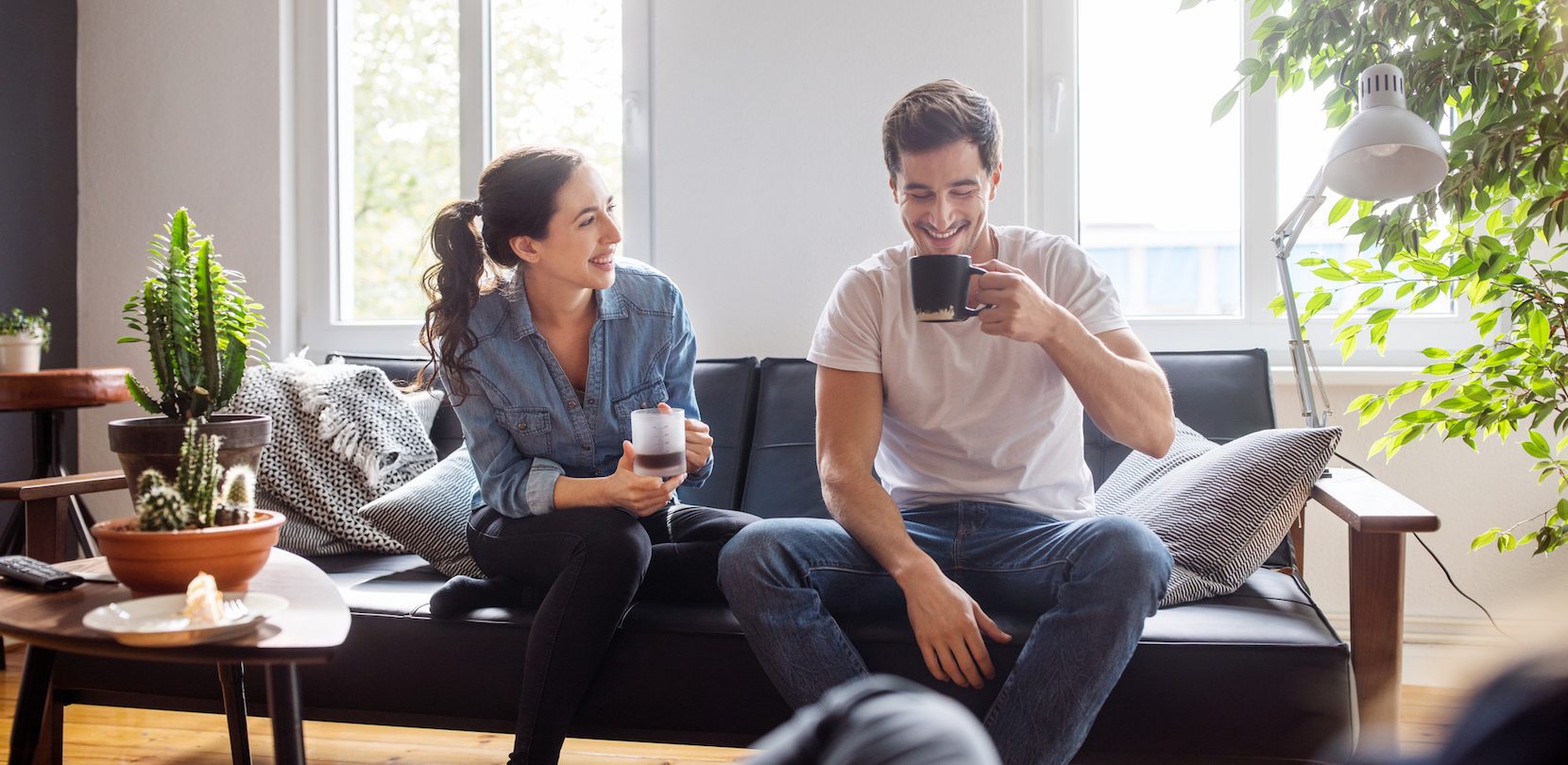 young couple in home bought with home loan