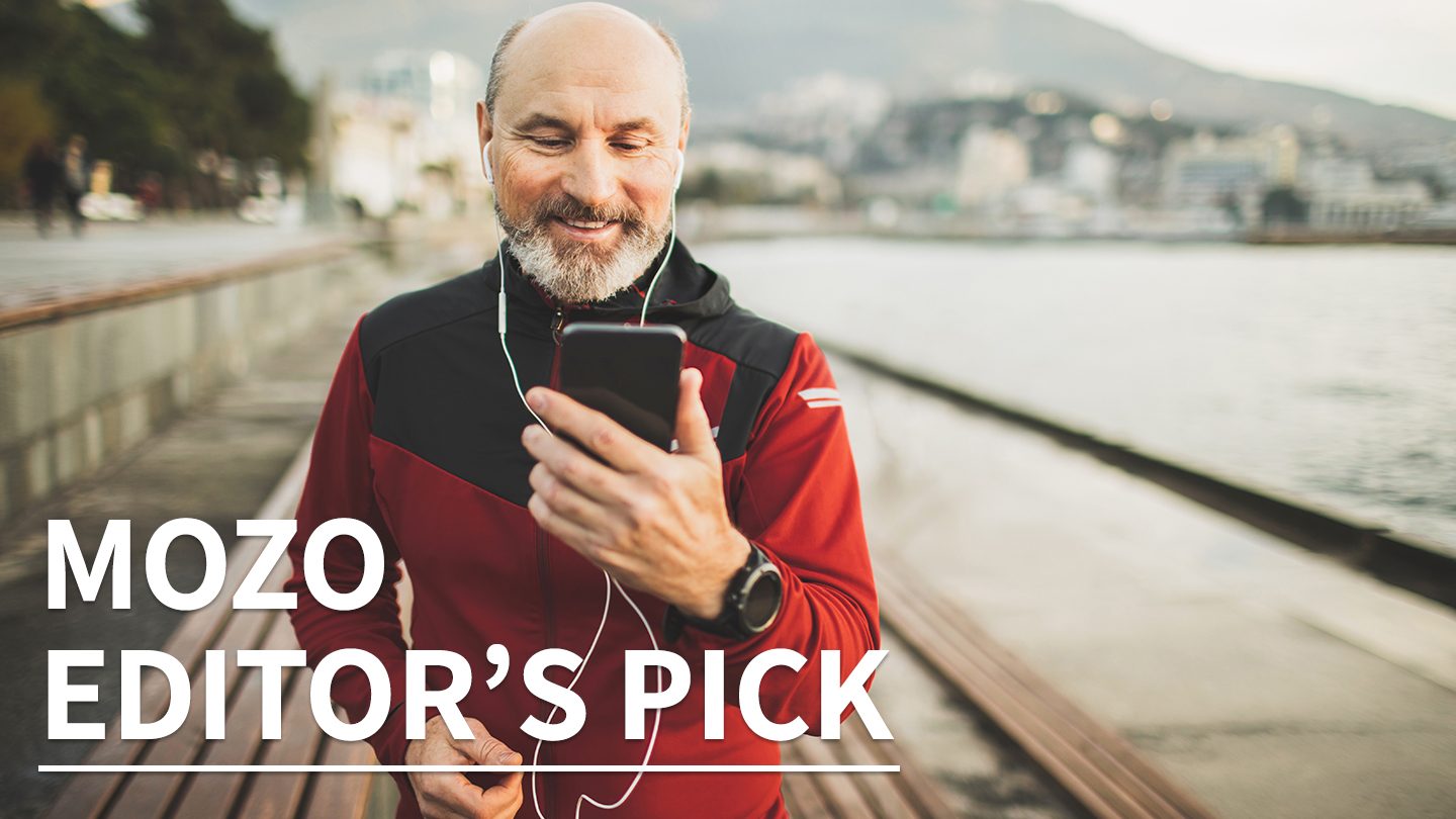 Old man jogging with his mobile phone. Mozo's editor pick text.