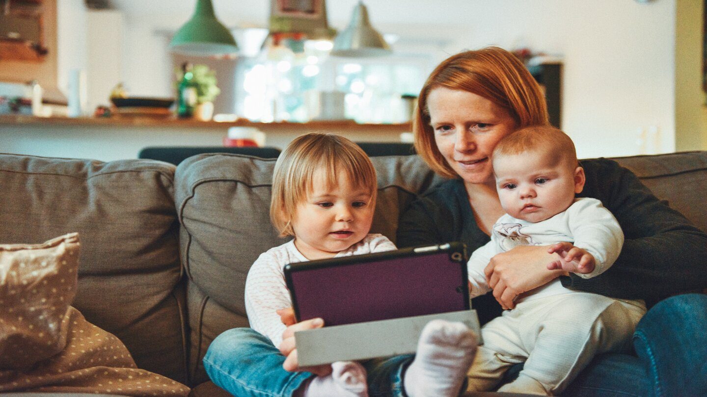 family looking at homes online ipad