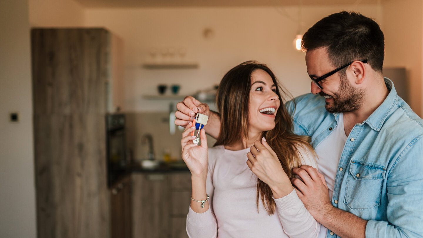 happy couple on a joint home loan happy to get their official house keys
