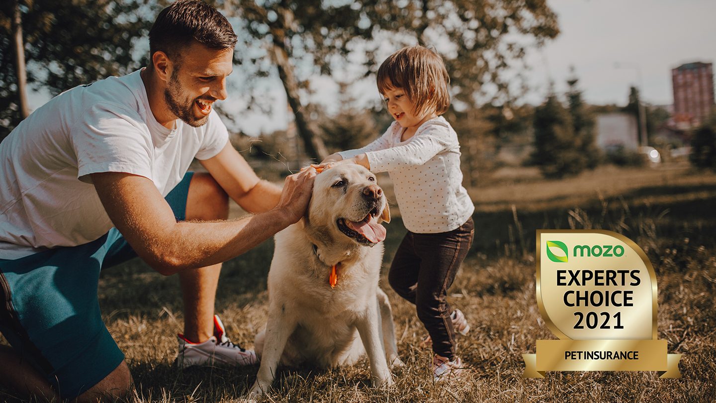 Man with a dog celebrating having the best MECA pet insurance.jpg