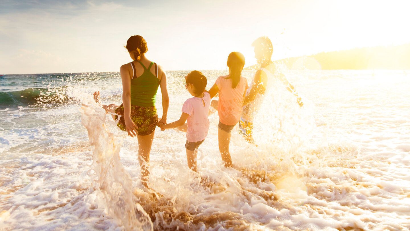 Family at the beach happy to support ethical supers
