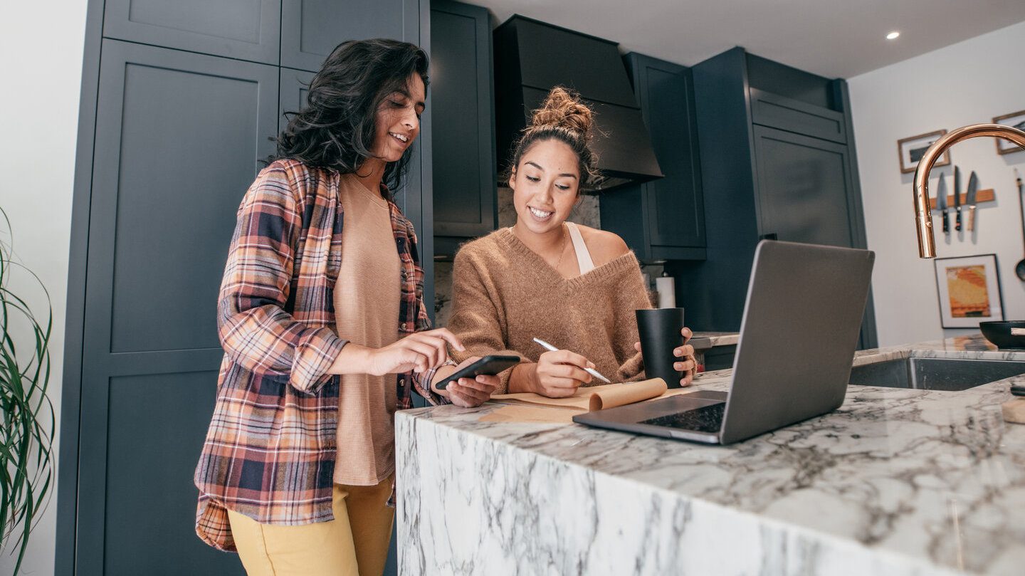 female couple looking at potential personal loans to apply for