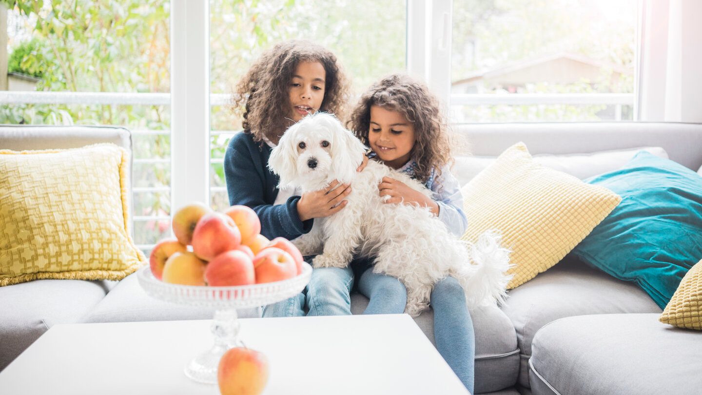 two girls with their new dog