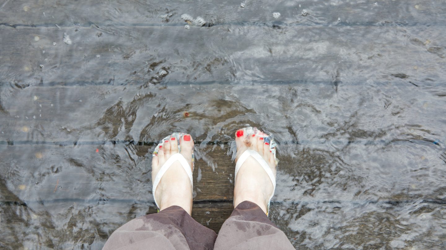 Feet in floodwater.