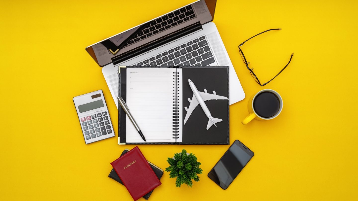 Travel gear on a yellow background