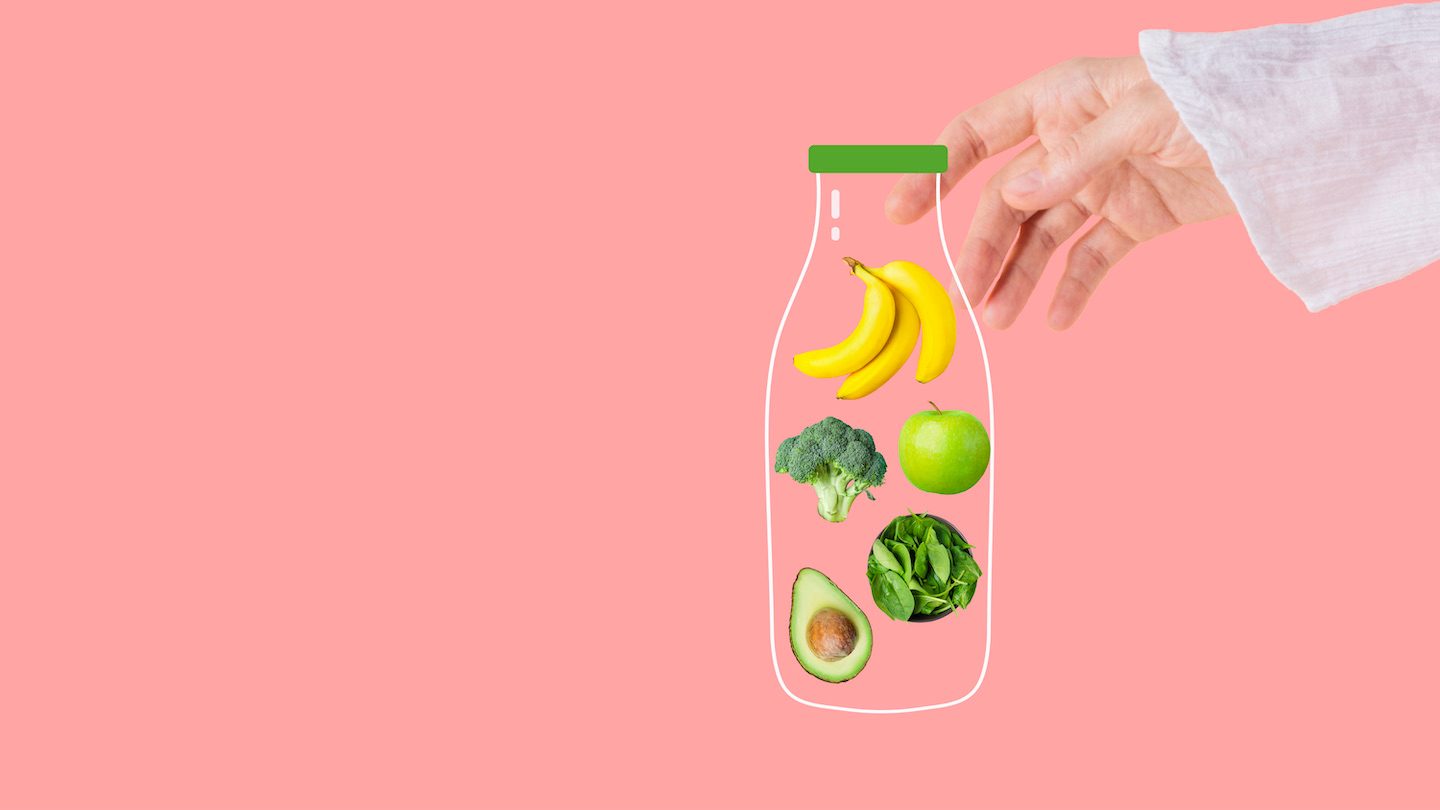 A hand holds a cartoon jar of fruit and veggies.
