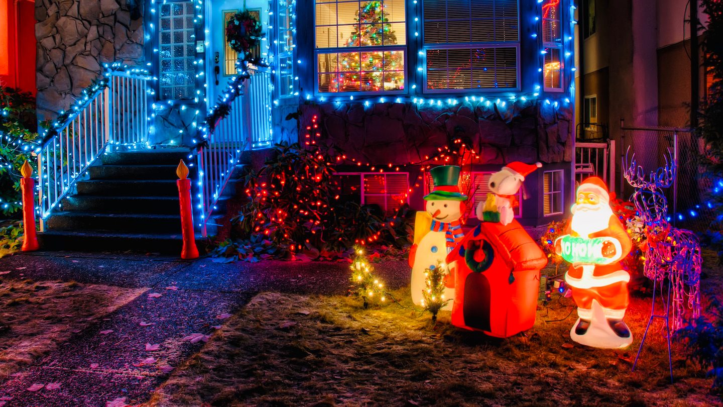 Christmas decorations outside a house. Night.