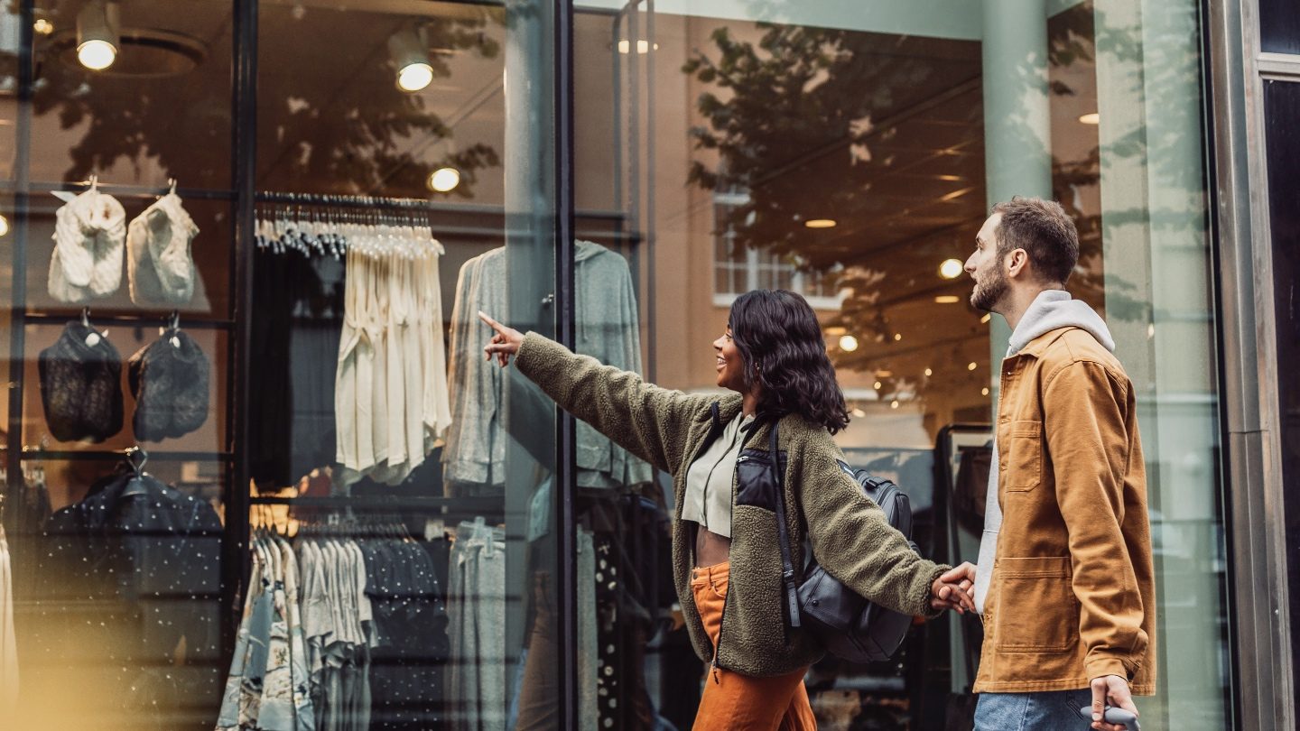 man and woman window shopping