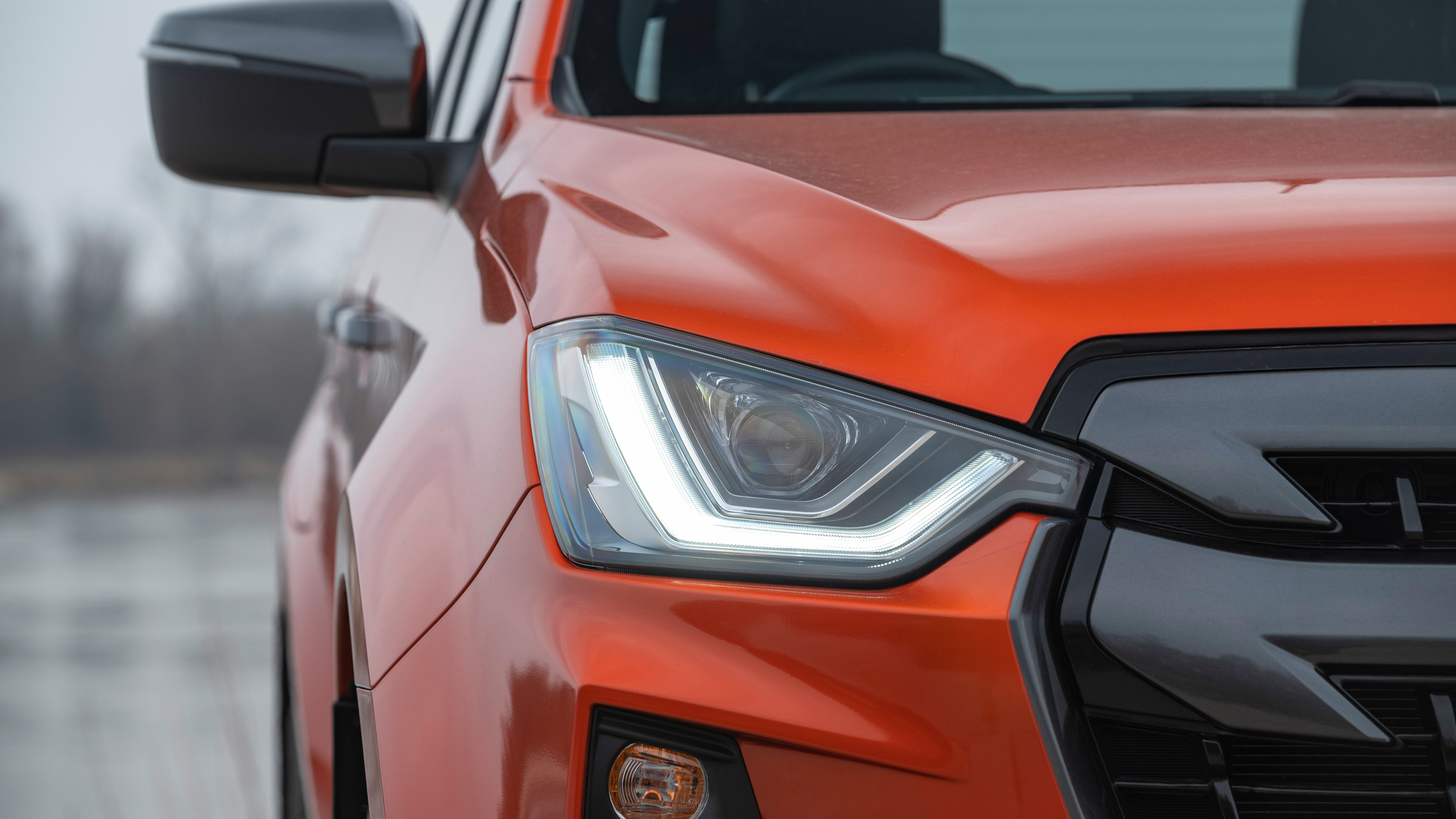 The front headlights of a modern SUV.