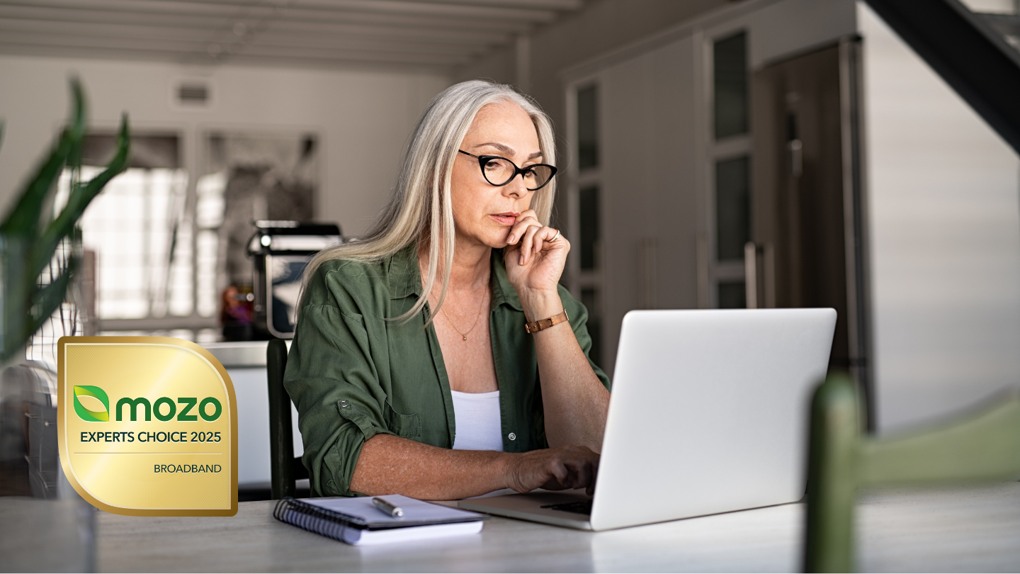 A Woman on her laptop researching broadband plans next to 2025 Mozo Experts Choice Awards badge for Broadband