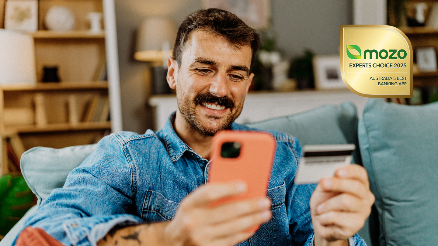 Man looking at award winning banking apps on Mozo.com.au