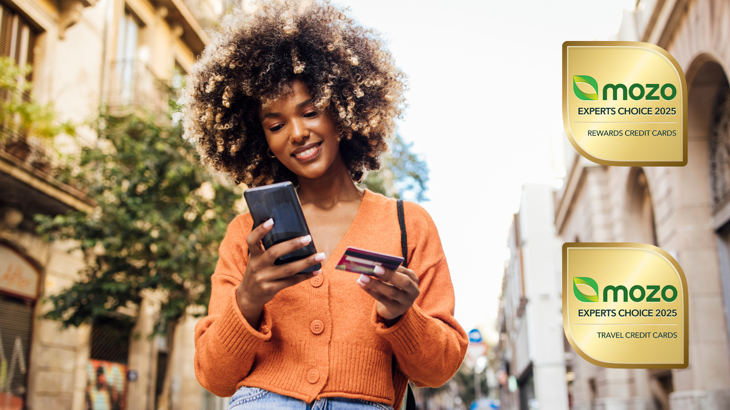Woman using a travel credit card next to Mozo Experts Choice Award for travel and rewards credit cards