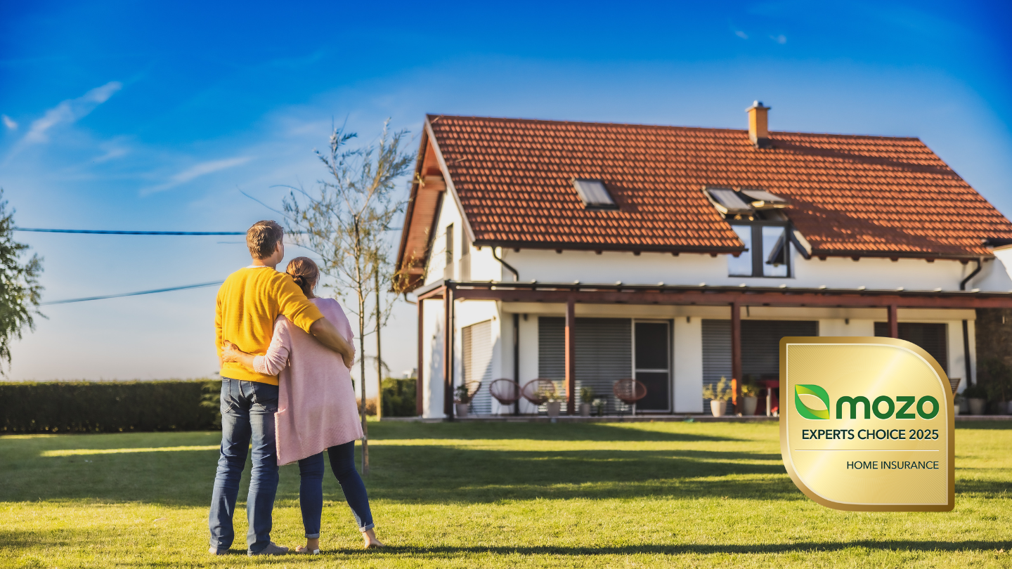 Couple standing in front of their home next to a Mozo Experts Choice Awards badge for home insurance