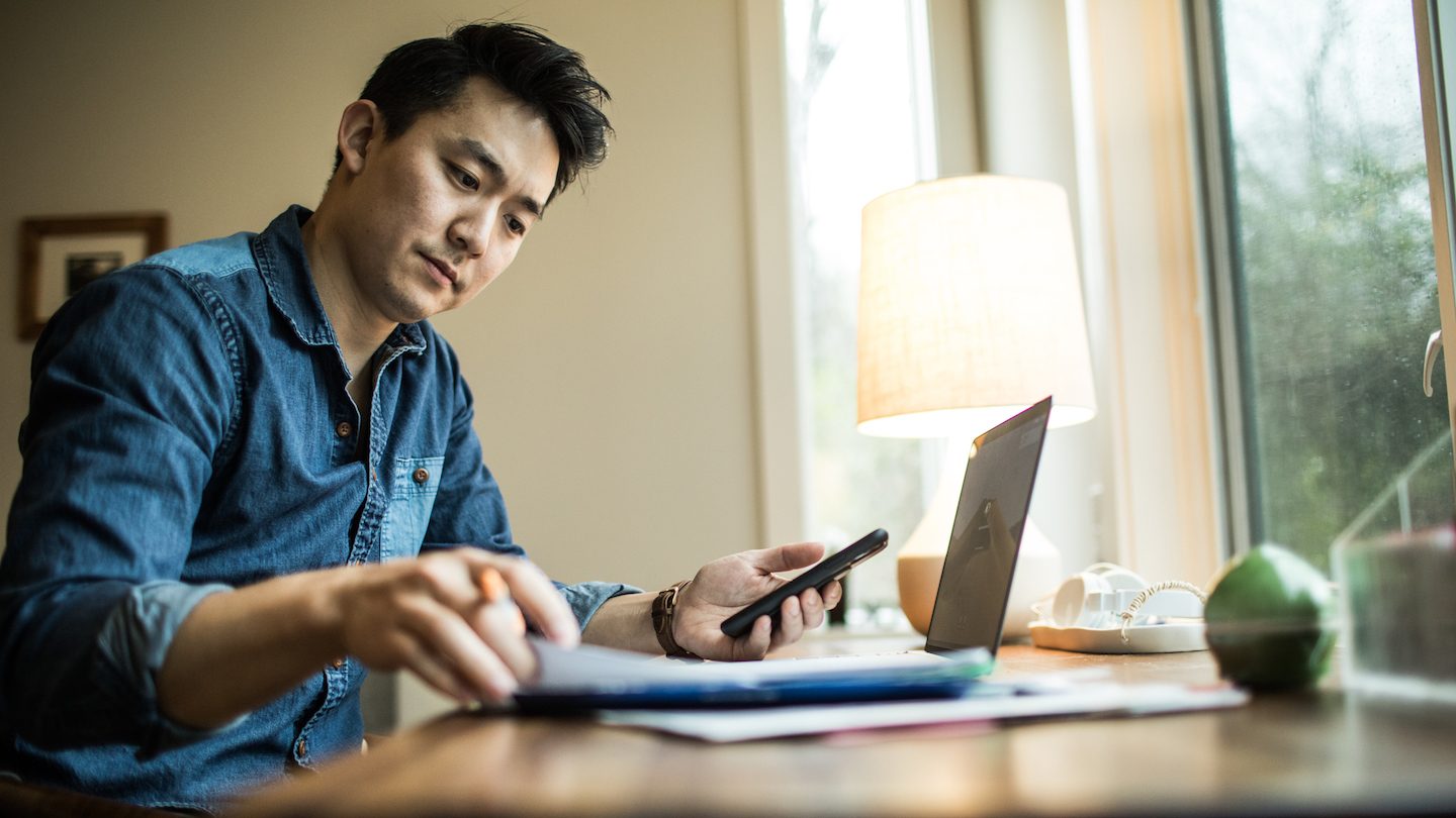 man weighing up personal loan or home loan redraw